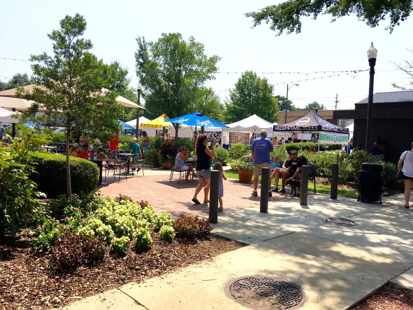 Shoppers and vendor tents at the Saturday market at Pepper Place in Birmingham.
