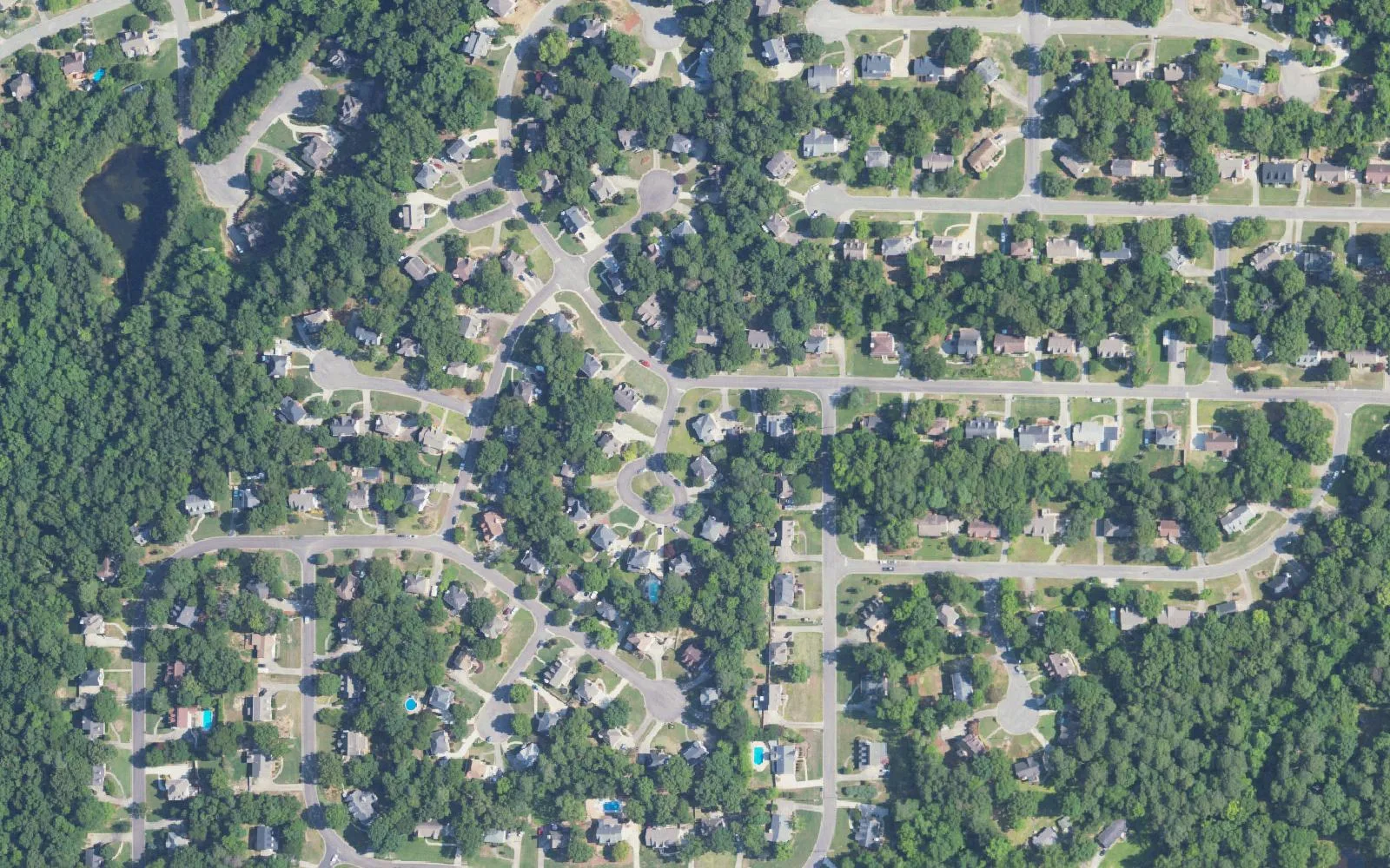 Homes on wooded streets and cul-de-sacs around Russet Woods Lane in south Hoover, seen from above.