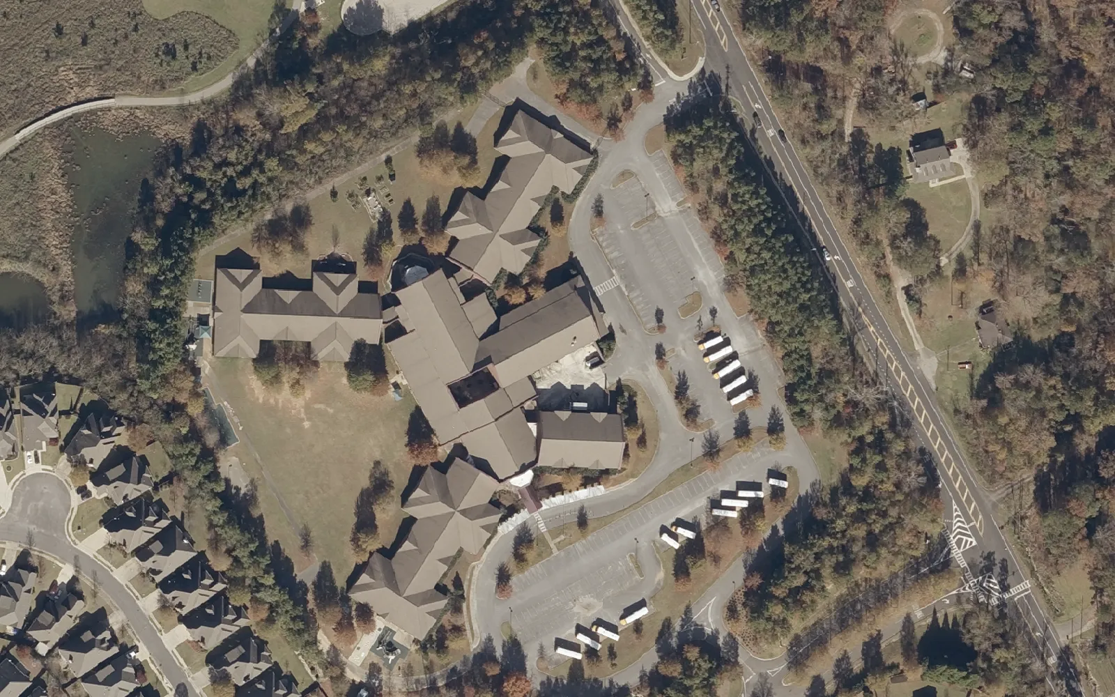 Aerial view of Riverchase Elementary School on Old Montgomery Highway in Hoover, with a pond and wetland to the north.