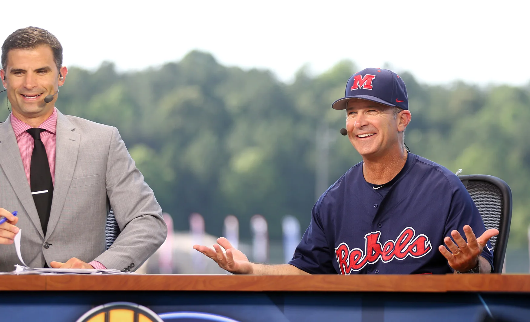 Ole Miss coach Mike Bianco, right, joins SEC Network analyst Chris Burke on the network's set at the 2016 SEC Baseball Tournament in Hoover.