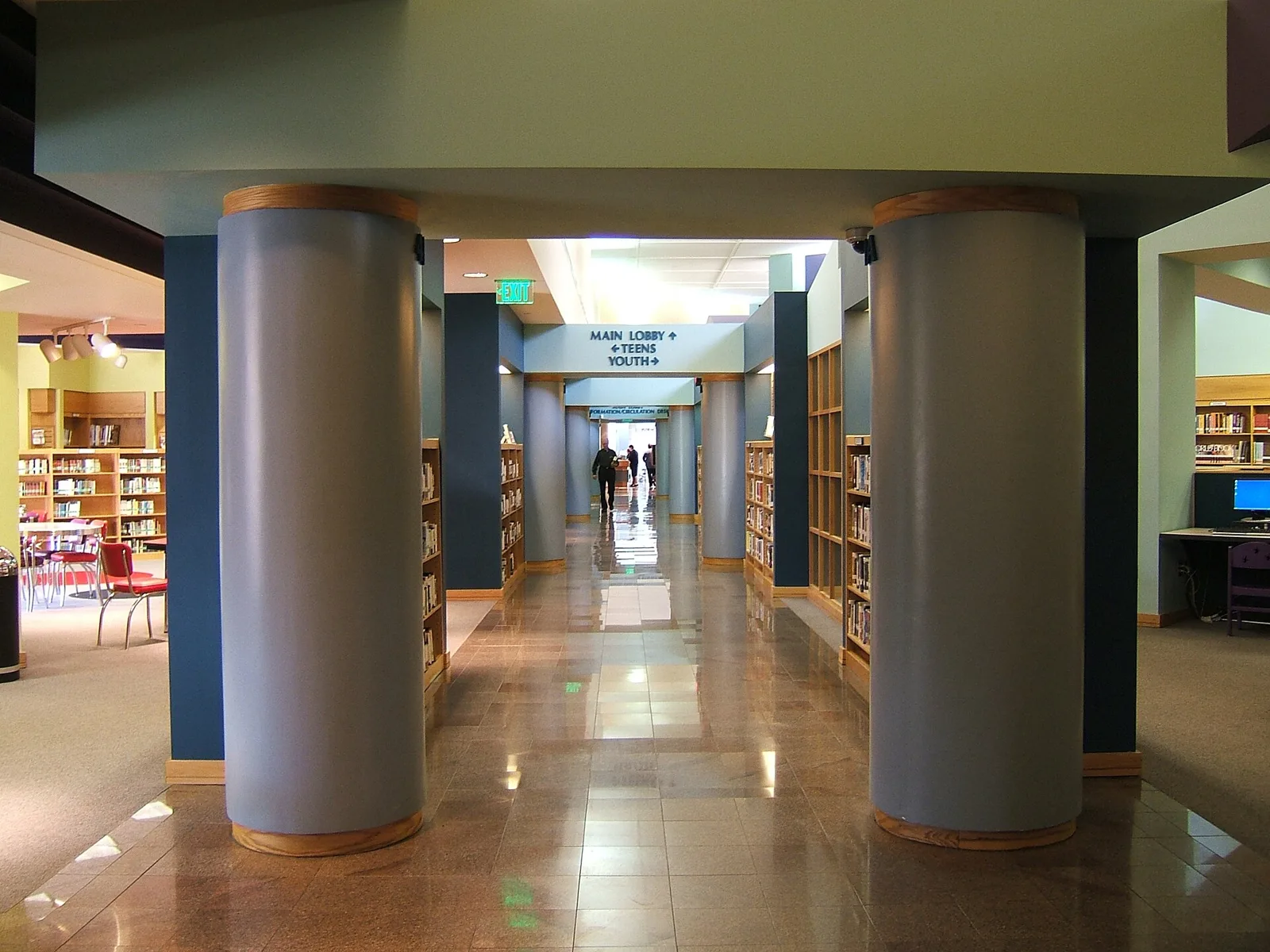 The main hallway of the Hoover Public Library on Municipal Drive, lined with bookshelves.