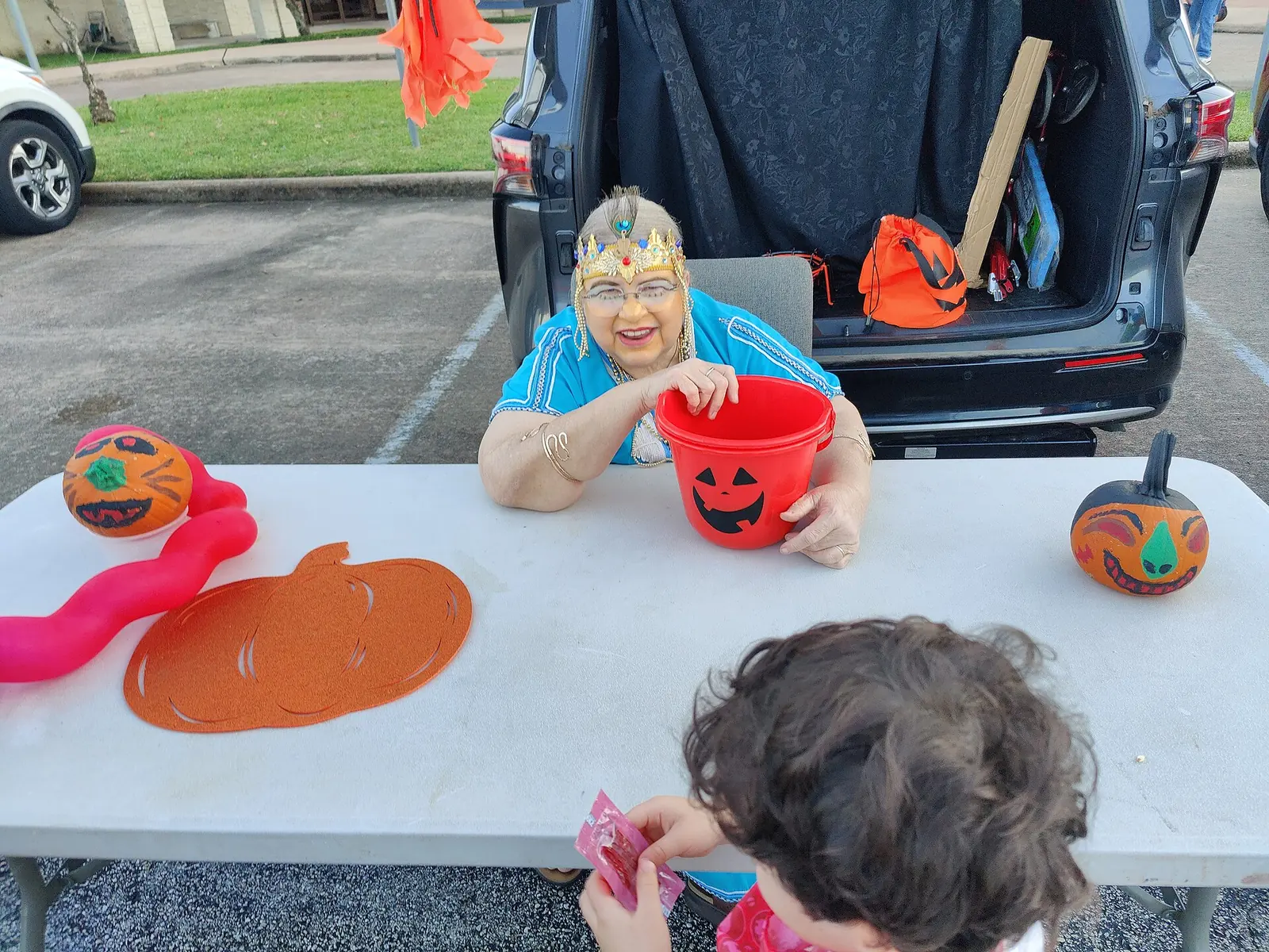 Decorated cars hand out candy at a church trunk-or-treat in Houston, Texas.